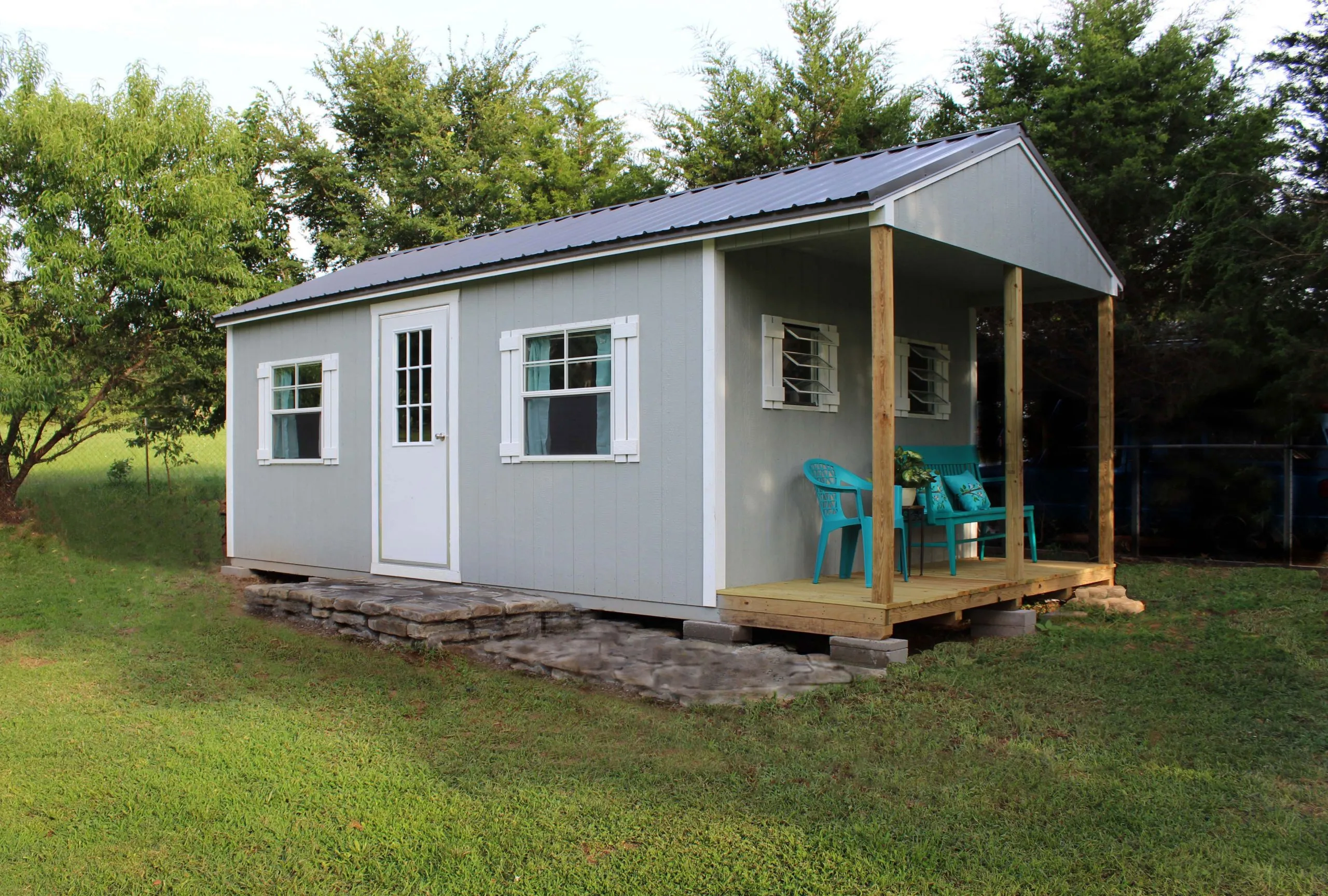 a frame pool shed with porch scaled 1